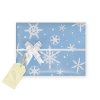 Winter Holiday Gift Wrap: Snowflake wrapping paper, bow, blue and white tissue paper, personalized gift tag