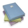 Pillowy, embroidered covers set these small journals apart.