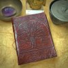 Our "Tree of Life" Journal is available in two sizes, with your choice of black or lavender lining (not shown here).