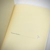 The flyleaf is a buttery beige with a space to add who "This journal belongs to ..."